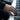 Lifestyle shot of oxidized silver Triumphant Atlas Ring worn on a man's hand while playing piano keys