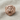 Fierce gorilla ring, rose gold, front view on fabric