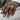 Roaring Tiger Ring, worn on model hand resting on car