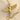 Close-up of the 14K gold vermeil Goddess Isis pendant resting on fine sand highlighting the divine ancient mythology design