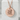 Do Kanji Coin Pendant, rose gold, front view on white block