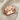 Eagle Crest Band Ring, rose gold plated, angled product photo on fabric
