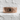 Dwarven Band Ring, rose gold, product photo on stone ledge