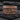 Twisted Rope Last Supper Ring, rose plated silver, front view on slate stone