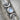 Close-up of the handcrafted oxidized silver wiccan triple moon cremation pendant showing intricate metalwork