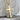 Rustic Latin Cross Pendant in gold vermeil, angled view on stone display