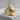 Sun Archer Ring, gold vermeil, angled view on stone base
