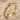 Dainty Snake Ring, gold vermeil, angled product photo on sand