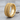 Biomechanical Spine Ring, gold vermeil, product photo on wood surface