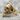 Skull Zihgir Ring, gold vermeil, angled view on stone surface