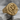 Chi Rho Laurel Signet Ring, gold vermeil, angled product photo on stone