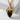 Black onyx dragon claw pendant, gold vermeil, front view on stone