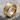 Ancient Artifact Ring, gold vermeil, angled view on stone base