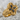 Floral Cross Ring in gold vermeil, angled product photo on stone
