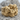 Men Embracing Ring, gold vermeil, front view on stone surface