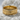 Amor Fati Ring, gold vermeil, product photo resting on stone surface