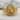 Sigma Lone Wolf Ring, gold vermeil, front view on stone surface