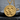 Double Venus Medallion Pendant, gold vermeil, front view on stone surface