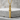 Mokume Katana Sword Pendant, gold vermeil, product photo on stone pedestal