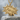 Manga Dokan Impact Pendant, gold vermeil, front view on stone pedestal