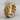 Floral Cuban Ring, gold vermeil, angled view on wood surface