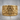 Masonic Scroll Ring, gold vermeil, front view on wood surface