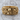 Calavera Skull Ring, gold vermeil, product photo on wood surface