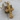 Gothic Lily Cross Pendant, gold vermeil, product photo on wood display