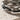 Intertwined Twig Ring, oxidized silver, close-up view of textured bark and leaves