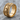 Skull Smoke Ring, gold vermeil, product photo resting on stone