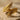 Twin Angel Wing Ring in gold vermeil, angled view on stone
