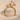 Two Giraffes Ring, gold vermeil, front view on sand