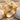 Rangefinder camera ring, gold vermeil, product photo on sand