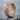 Woven Celtic Knot Ring, rose gold, product photo on stone surface