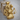 Triple Hecate Pendant, gold vermeil, product photo on wood surface