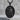 Saint Roch Pendant, black rhodium, product photo on stone