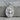 Saint Sebastian Pendant, polished silver, product photo resting on stone