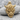 Horned Oni Mask Pendant, gold vermeil, front product view on stone
