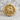 Agnus Dei ring, gold vermeil, front view on stone surface