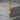 Crucified Christ Pendant, gold vermeil, product photo on pedestal