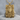 Surrealist Sci-Fi Pendant, gold vermeil, front view on stone surface