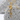 Stem rose pendant, gold vermeil, front view on textured stone