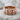 Skull and Stars Ring, rose gold, product photo resting on stone surface