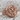 Alpha Omega Chi Rho Ring, rose gold, product photo resting on stone