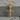 Braided Nail Cross Pendant, gold vermeil, product photo on stone