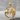 Lion Lioness Pendant, gold vermeil, front view on stone surface