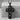 Memento Mori Cross Pendant, black rhodium, front view on stone pedestal