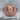Ram Signet Ring, rose gold, front view on stone surface
