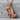 Folded Prayer Hands Pendant, rose gold, product photo on stone pedestal
