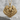 Eagle Wings Pendant, gold vermeil, front view on stone surface